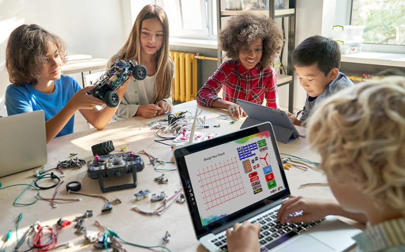 Young students engaged in a learning activity, highlighting hands-on educational fun.