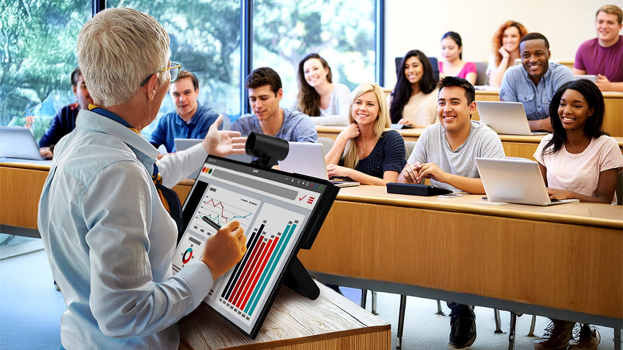 A university professor engaging students using the SMART Board Mini Interactive Podium to display graphs and charts.